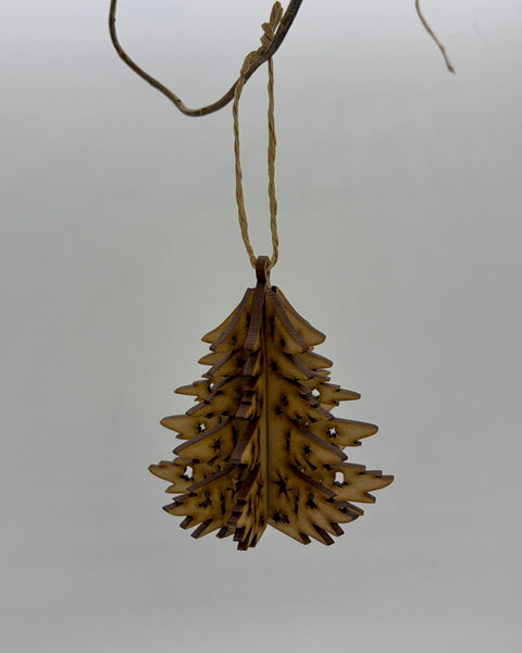 A wooden, hanging decoration of a Christmas tree