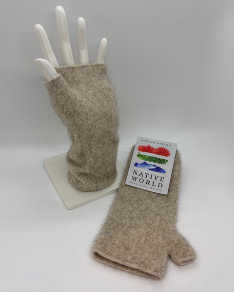 Pair of beige wrist warmers on a white mannequin hand with a ‘Native World’ brand tag.