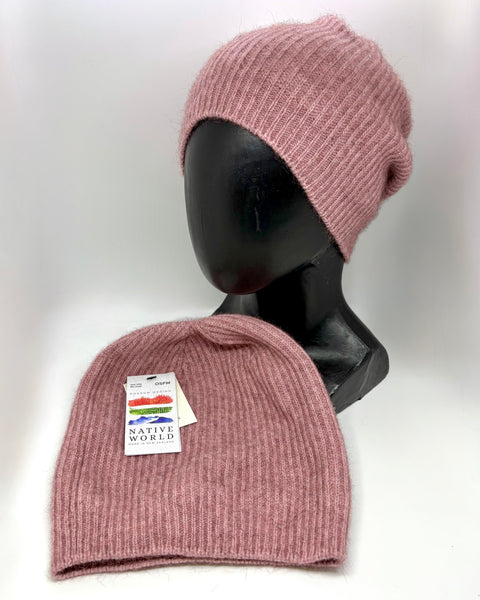 Pink knit beanie on a mannequin head with a tag labeled 'Native World' on a white background