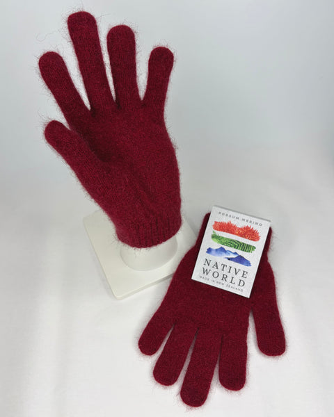 Red gloves with a 'Native World' label on a white background