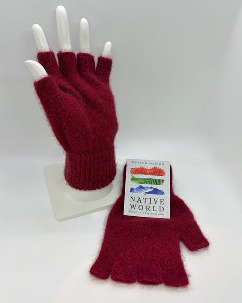 Red fingerless gloves on a white mannequin hand with a ‘Native World' brand tag