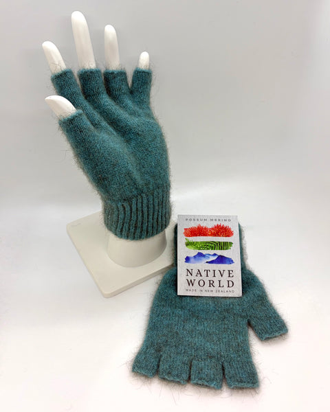 Pair of teal fingerless gloves on a mannequin hand with a ‘Native World’ brand label on a white background