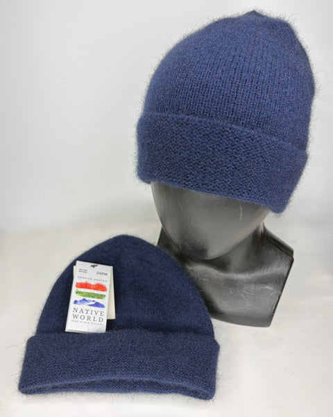 Two navy knit beanies on a mannequin head and a flat surface with a ‘Native World’ label