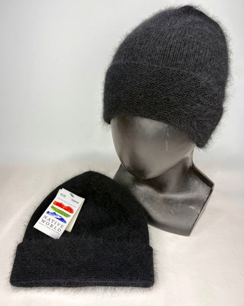 Two black knit beanies on a mannequin head and a flat surface with a visible ‘Native World’ brand tag