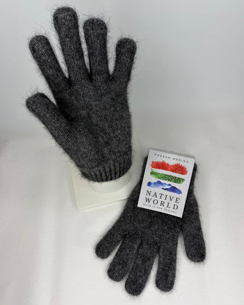 Pair of gray gloves with a Native World label on a white background