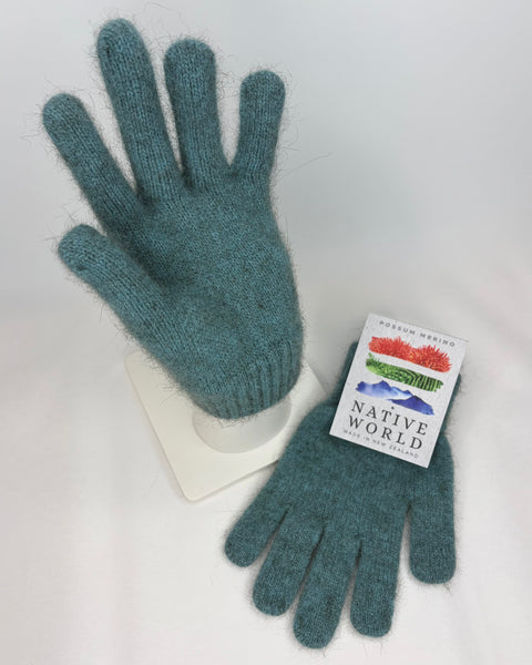 Pair of teal gloves with a Native World label on a white background