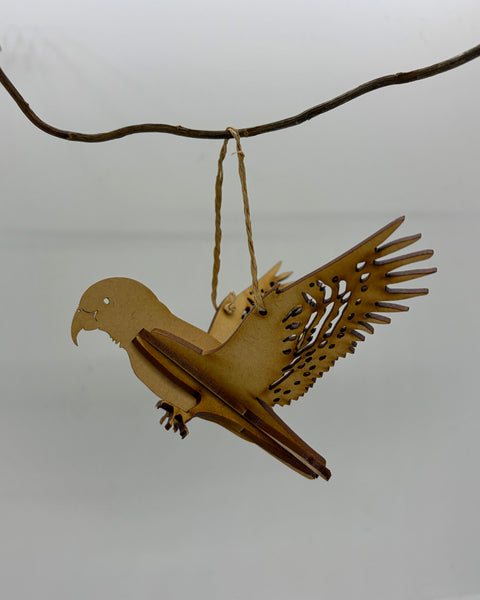 A wooden hanging decoration of a kea parrot