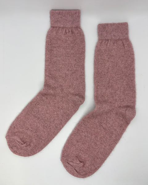 Pair of pink socks on a white background