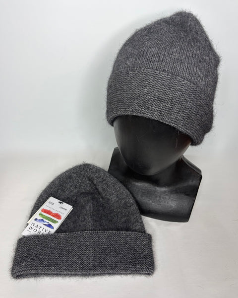 Gray knit beanie on a mannequin head with a visible ‘Native World’ brand tag