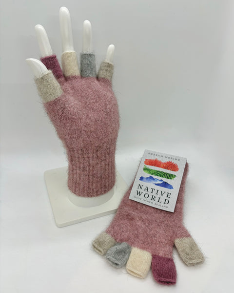 Pink fingerless gloves on a mannequin hand with a ‘Native World' tag on a white background.