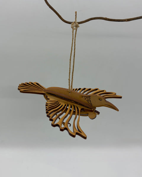 Wooden hanging decoration of a tui bird
