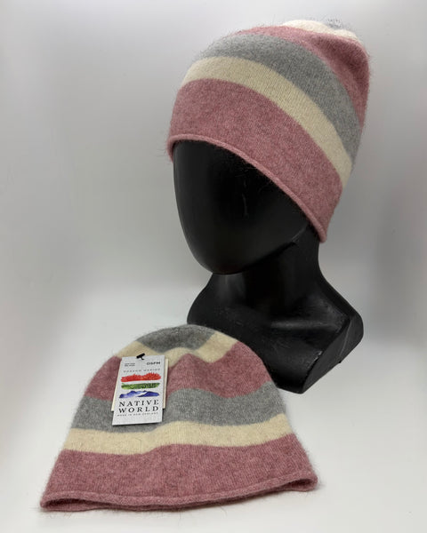 Striped pink knit hat on a mannequin head with a tag labeled 'Native World' against a white background.