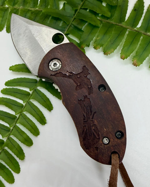 Wooden pocket knife with New Zealand map engraving
