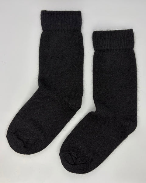 Pair of black socks on a white background