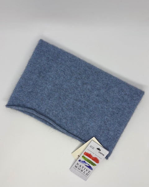 Blue knitted neck warmer with a Native World tag on a white background