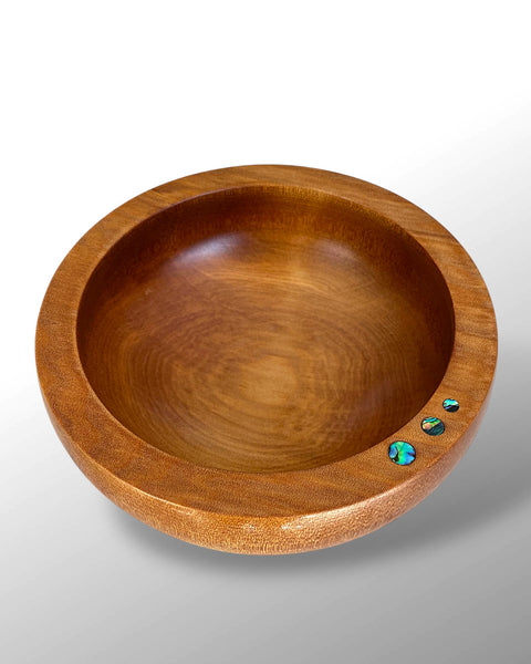 Top View of a Handcrafted NZ Native Ancient Swamp Kauri Wood Turned Bowl with three circular Paua Shell pieces inlaid in the rim.