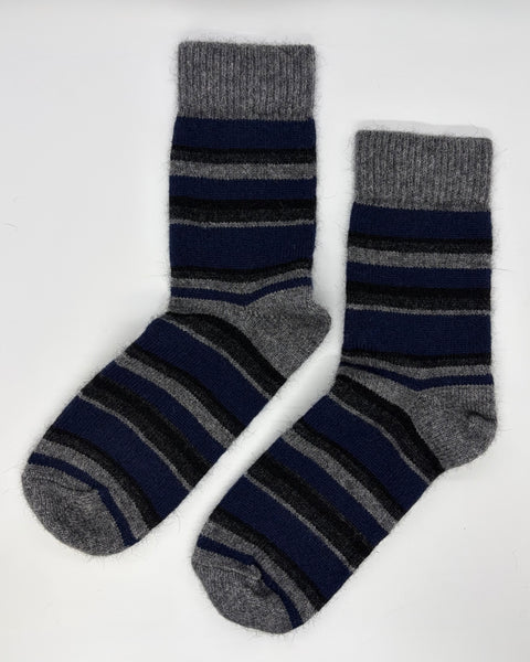 Pair of grey and navy striped socks on a white background