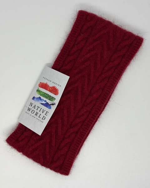Red knitted headband with a 'Native World' label on a white background