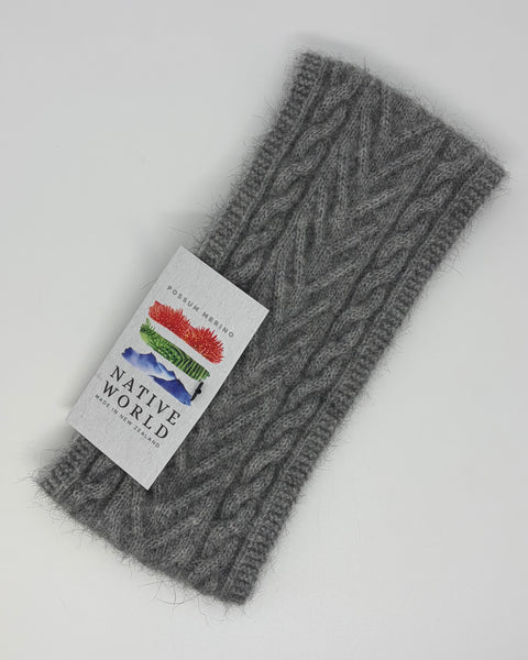 Grey knitted headband with a 'Native World' label on a white background