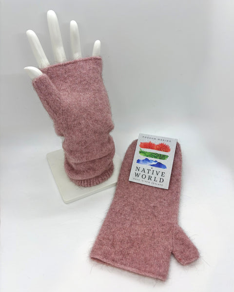 Pink fingerless gloves with a ‘Native World’ tag on a white mannequin hand 