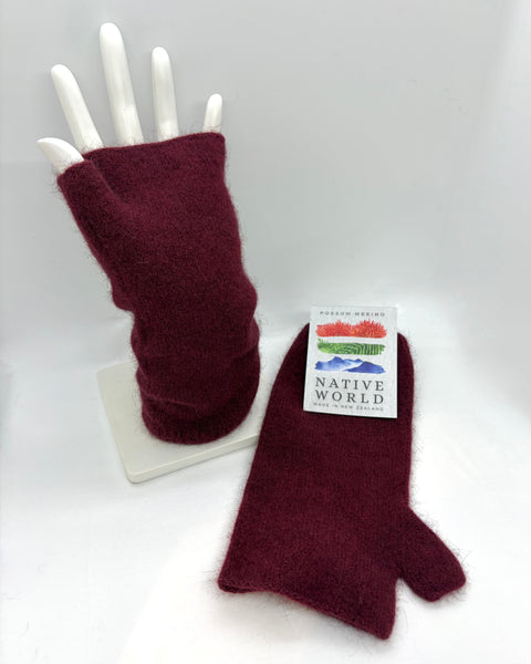 Pair of maroon fingerless gloves on a white mannequin hand with a 'Native World' label.