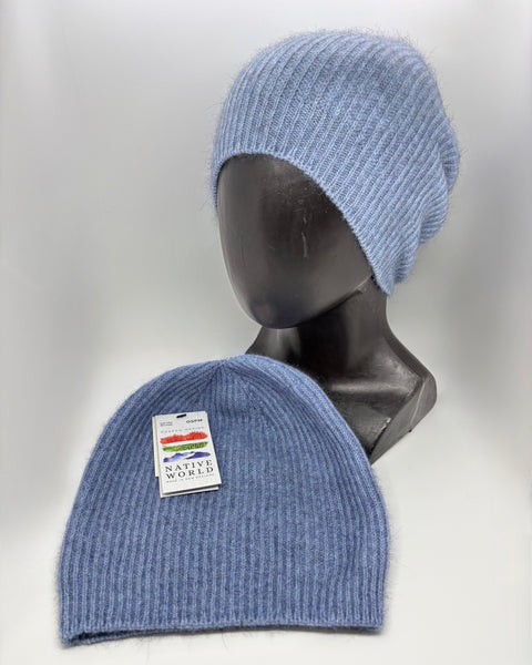 Two blue knit beanies on a mannequin head and flat surface with a visible ‘Native World’ brand label.