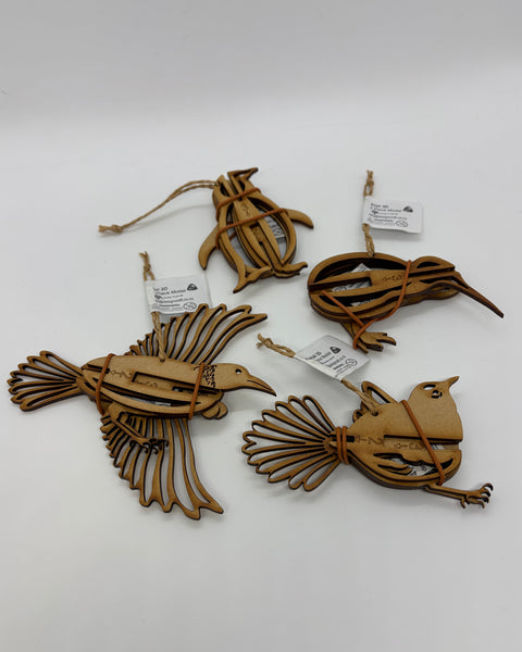 Four wooden hanging decorations of birds