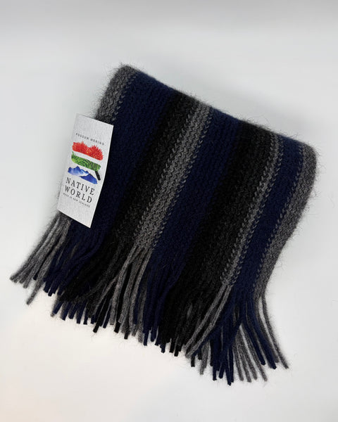 Striped knitted navy and grey scarf with a ‘Native World’ tag on a white background