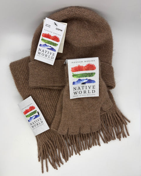 Brown scarf, Beanie and fingerless gloves with 'Native World' tags on a white background