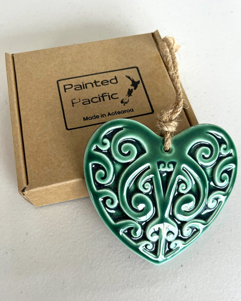 Ceramic Green Heart decoration in a gift box with traditional Maori Kowhaiwhai design and twine loop for hanging. Made in Aotearoa New Zealand by Painted Pacific Pottery.