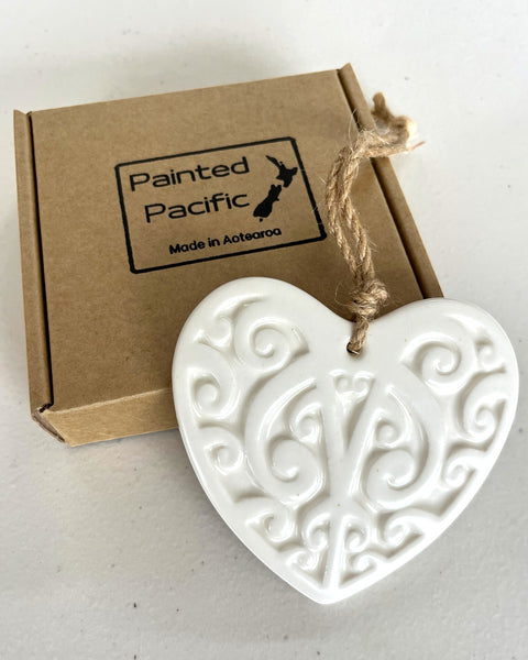 Ceramic White Heart decoration in a gift box with traditional Maori Kowhaiwhai design and twine loop for hanging. Made in Aotearoa New Zealand by Painted Pacific Pottery.