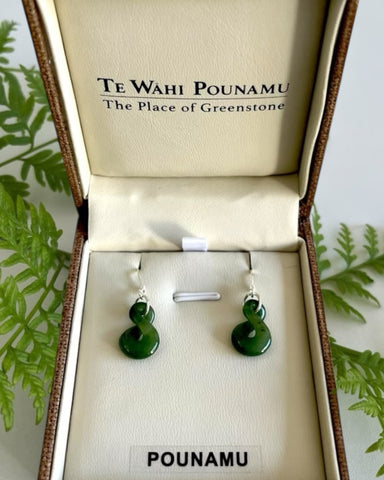 New Zealand Greenstone Pikorua (Single Twist) drop earrings with Sterling Silver hooks, in a brown woven-style jewellery box.