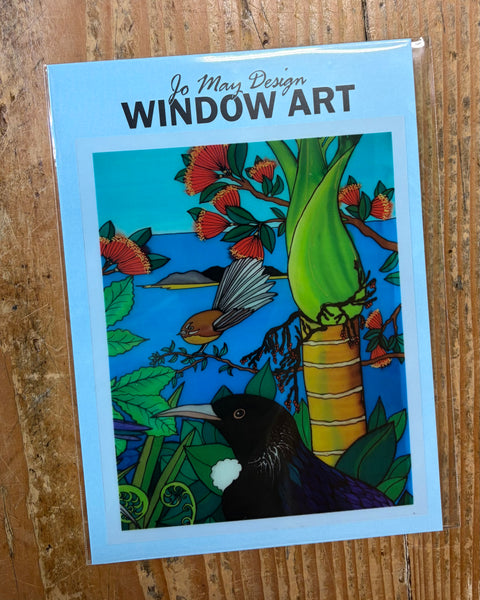 Window art decal design with birds on a wooden surface