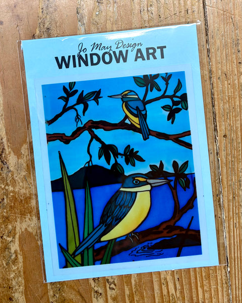 Window decal design with kingfisher birds on a wooden surface