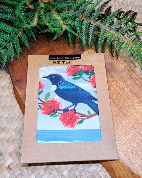 A lens screen cleaning cloth featuring the NZ Tui by the seashore, amongst the Pohutakawa flowers.

Cloth dimensions: 14.5cm x 14cm
