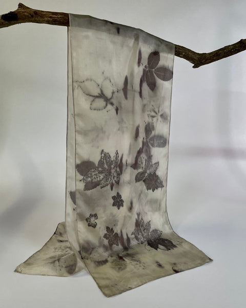 Cream coloured silk scarf with botanical print of rose leaves.